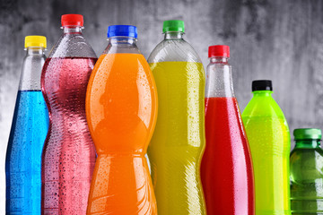 Obraz na płótnie Canvas Plastic bottles of assorted carbonated soft drinks