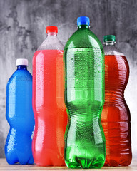 Plastic bottles of assorted carbonated soft drinks