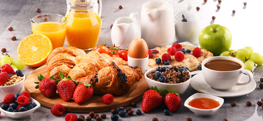 Breakfast served with coffee, juice, croissants and fruits