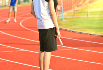 Athlete in the starting blocks for a relay race.