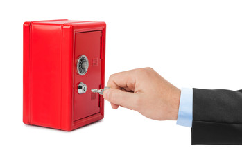 Hand and red toy safe