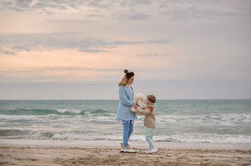 Mom and son on the beach.