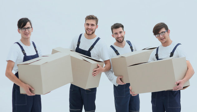 photo workers holding boxes when moving flats,