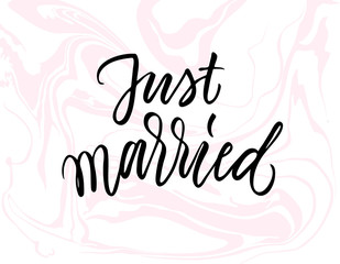 Just married calligraphy on light pink marbled background.