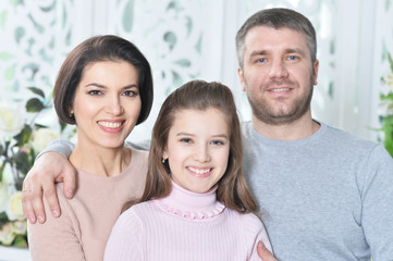 Fototapeta premium Close up portrait of cute little girl with her parents 