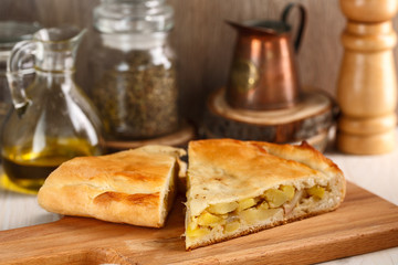 slices of homemade potato pie on cutting board