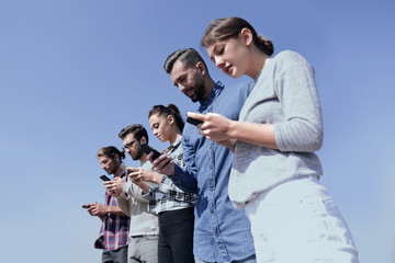 young people using smartphones to search network