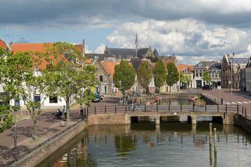 Obraz premium Cityscape of Sneek at the Balthuskade and Prinsengracht (Canal) and the Rienck Bockemakade seen from the Waterpoort (Water gate) in the province Friesland, The Netherlands