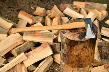 Ax against the background of chipped firewood
