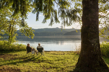 Two seniors enjoying sunset at Cottage Grove Lake, OR, USA