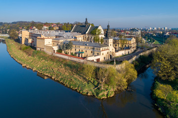 Fototapeta na wymiar Krakow, Poland. Norbertine female convent, church, Vistula and Rudawa rivers and far view of Kosciuszko Mound. Aerial photo.