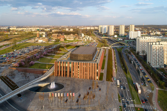 Katowice aerial skyline with a central urban highway (Drogowa Trasa Srednicowa), blocks of flats, NOSPR concert hall, old mining infrastructure, Silesian museum, bridges, parking, lawns and cars © kilhan