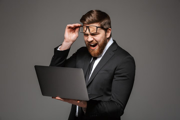 Portrait of an angry young businessman dressed in suit