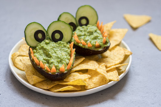 Funny alligator avocado guacamole dip and nachos