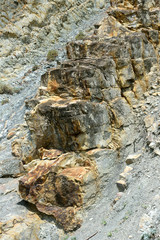 Beautiful structure of the rock, large and sharp edges of one of the rock layers