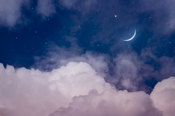 Naklejka na ściany i meble The sky at night with stars. New moon . Ramadan background . Prayer time . Dramatic nature background . Arab night 