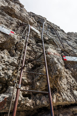 Metal ladder in mountains.