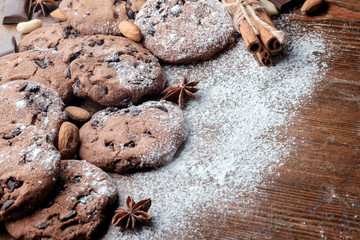 Chocolate chips cookies on table with dark rustic texture and with copy space for your text....