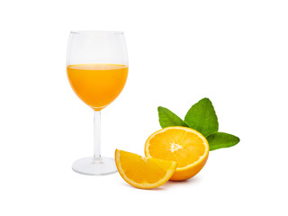 a glass of fresh orange juice and group of fresh orange fruits with green leaves, isolated on white background. fruit product display or montage, studio shot