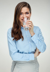 Businesswoman drinking water with glass.