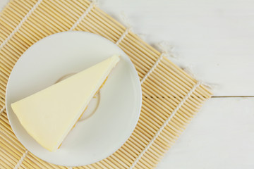 classic cheesecake on white plate on  white table