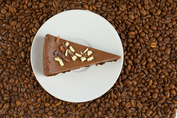 chocolate cheesecake on white plate on  wooden table