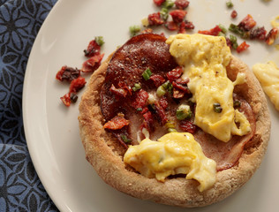 Bacon and egg with tomato and spring onion.