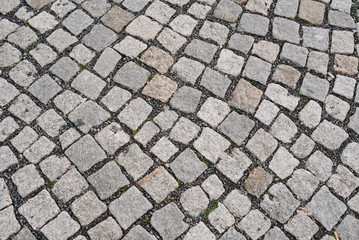 Road and stones. Old paving tiles background texture