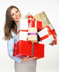 Smiling woman holding big pile of presents.