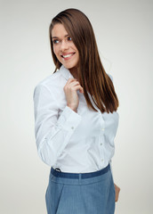 Smiling businesswoman  wearing white shirt looking back.