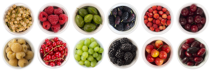 Red, black, yellow and green food. Sweet and juicy berry with copy space for text. Rasberries, blackberries, currants, mulberries, gooseberries and grapes. Top view. 