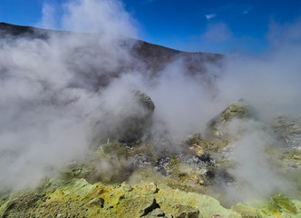 Sulphur gas coming out of the edge of the volcanic crater on the Vulcano island in the Aeolian islands, Sicily, Italy

