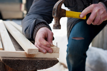 Hammering nails with a hammer