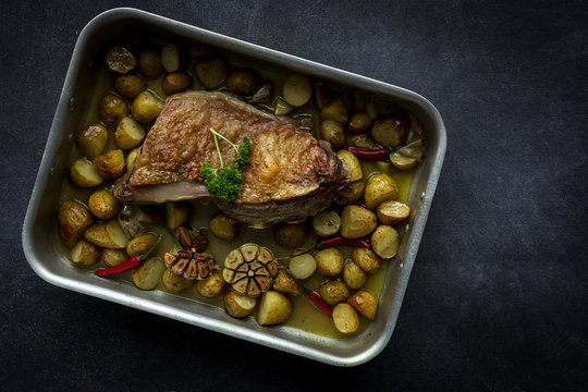 From Above a roast lamb with potatoes