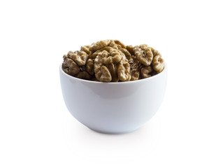 Kernels walnuts isolated on white. Walnuts in a bowl isolated on white background. Walnuts with copy space for text on a white background
