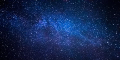 Foto op Canvas Melkwegstelsel en duizenden sterren aan de nachtelijke hemel © YuriFineart