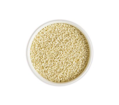 Sesame on white background. Top view. White sesame in a bowl isolated on white background. Sesame with copy space for text.
