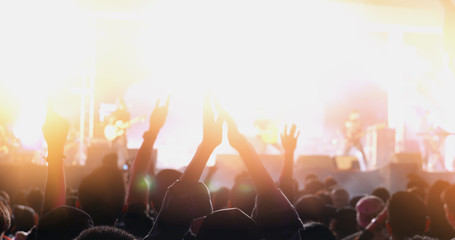 silhouettes of concert crowd in the outdoor,night light and lens flare