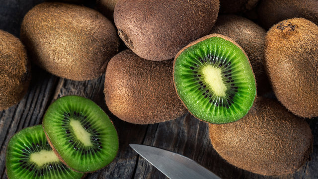 Kiwi fruits on wooden background