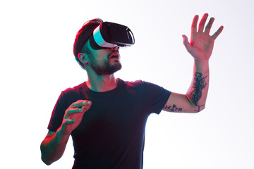 Tattooed man exploring virtual world