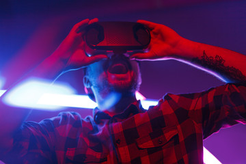 Expressive man gaming in VR glasses