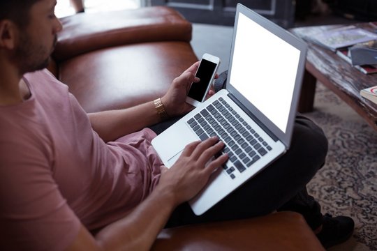 Male customer using laptop