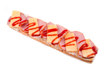 Huge sandwich on white bread with sausage