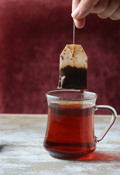 Dipping A Tea Bag Into A Glass