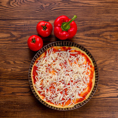 Fresh original Italian raw pizza, preparation in traditional sty