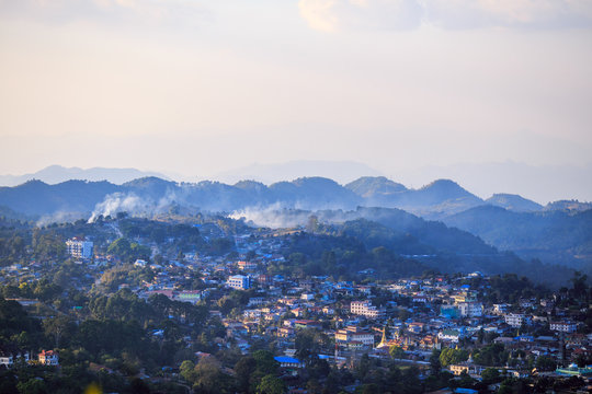 Smoke from controlled burns drifts across the small mountain town of Kalaw, Myanmar