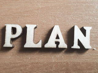 The word 'plan' made of wooden letters. wood inscription