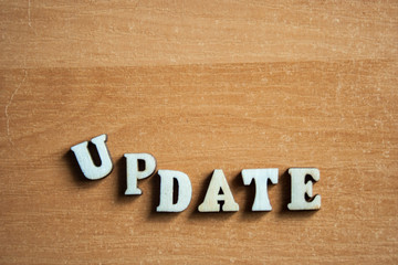 Fototapeta premium The word 'update' made of wooden letters. wood inscription