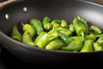 Green Padron Peppers in the Frying Pan. Pimientos de Padron.