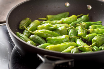 Green Padron Peppers in the Frying Pan. Pimientos de Padron.